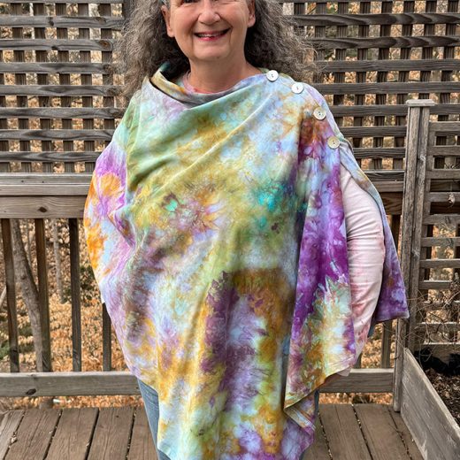 Women's handmade and hand dyed poncho with buttons.
