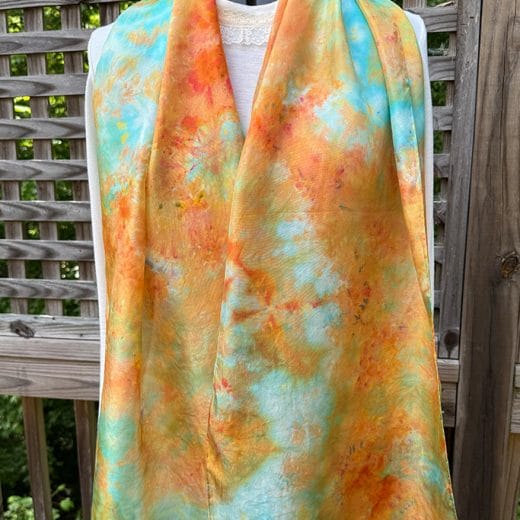 Unique hand dyed silk scarf in different shades of aqua, turquoise, green and orange