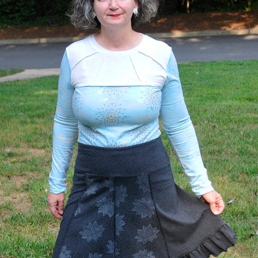 Women's ruffled panel skirt with yoga waistband, handmade with a charcoal grey cotton jersey and hand printed with lotus flowers