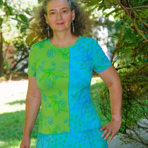 Women's wearable art floral a-line short sleeve tunic handmade with a lime green and a turquoise jerseys that I hand printed with my artwork.