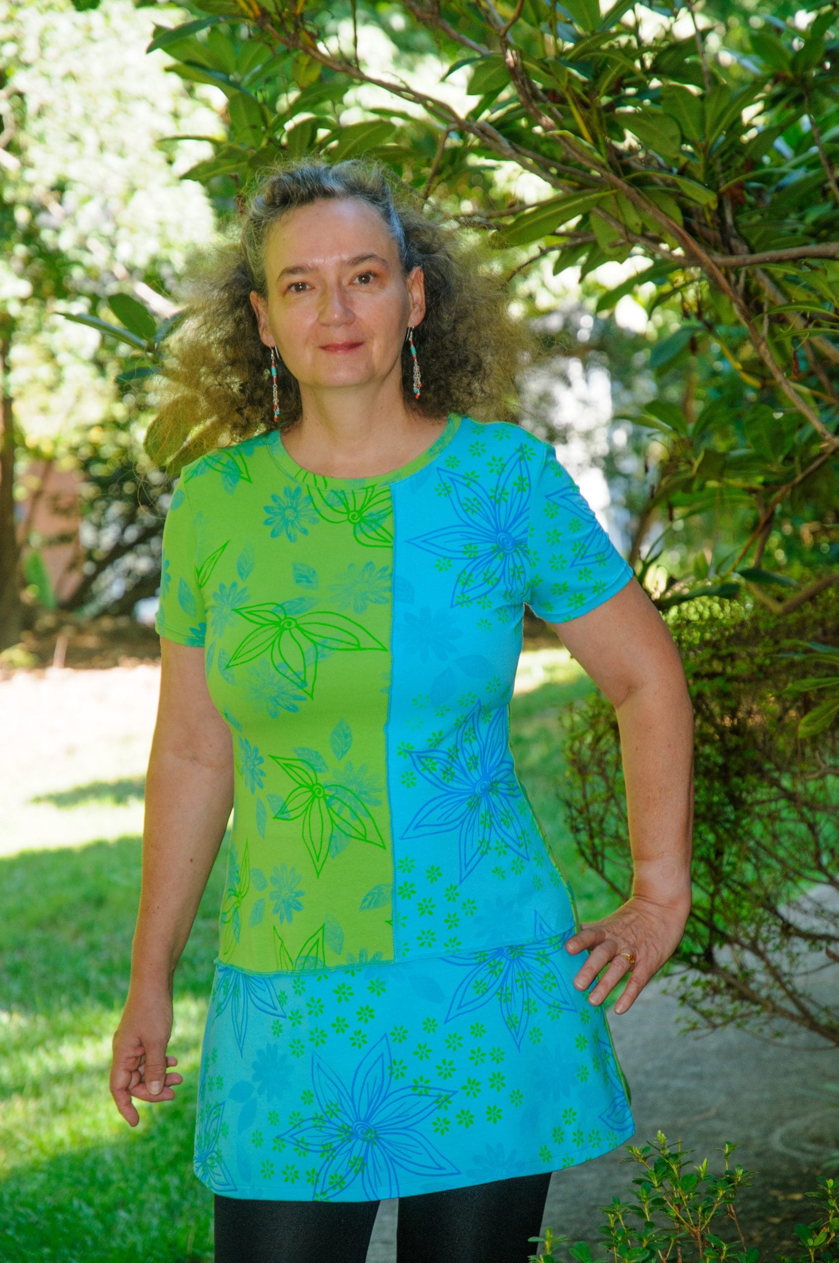 Women's wearable art floral a-line short sleeve tunic handmade with a lime green and a turquoise jerseys that I hand printed with my artwork.