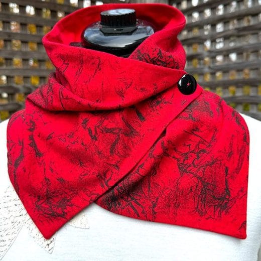 Women handmade red cotton neck scarf and hand printed with a black abstract pattern.