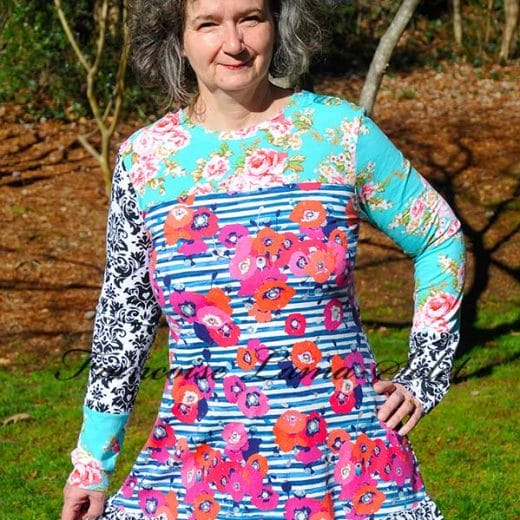 Women's a-line ruffled tunic with long sleeves handmade with a mix of colorful floral, damask and striped cotton jersey.