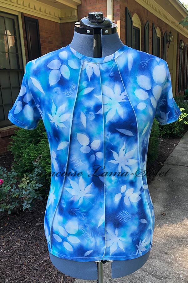 Indulge in the beauty of hand-painted fashion with this unique women's top. The leaf print design and comfortable fabric make it perfect for any occasion.