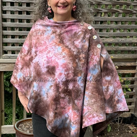 Women's handmade and hand dyed poncho in different shades of brown, pink and blue