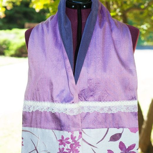 Women's silk scarf handmade with a floral linen and a solid lavender silk, embellished with lace.