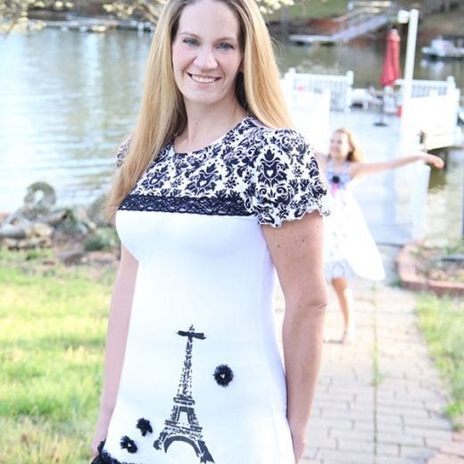 Women's black and white tunic with puff sleeves hand printed with the Eiffel Tower.