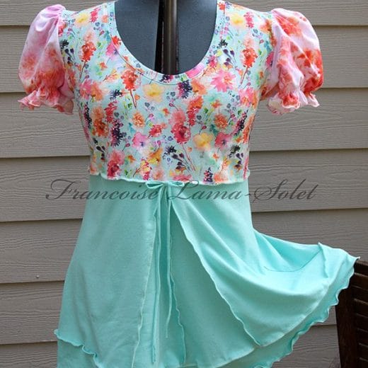 Women's puff sleeve tunic swing top handmade with a combination of solid mint fabric paired with a floral jersey and a hand dyed jersey.