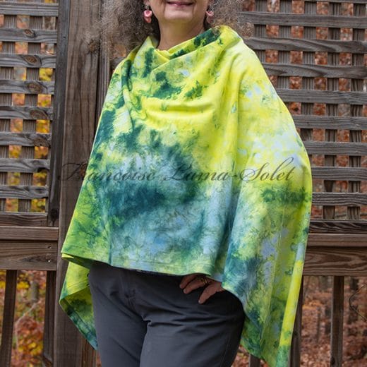 Unique women's poncho with buttons handmade with a cotton lycra jersey and ice dyed in different shades of blue, green and yellow.