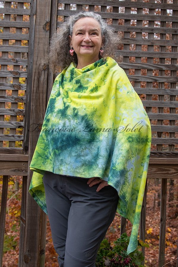 Unique women's poncho with buttons handmade with a cotton lycra jersey and ice dyed in different shades of blue, green and yellow.
