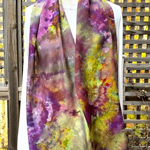 Women's silk scarf ice dyed in different shades of purple, green, hot pink and more.