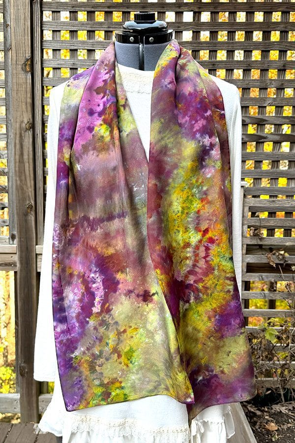 Women's silk scarf ice dyed in different shades of purple, green, hot pink and more.