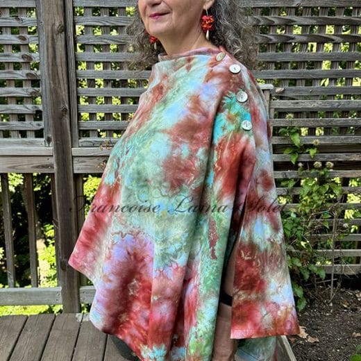 Women handmade and ice dyed poncho in different shades of terracotta, lavender and green.