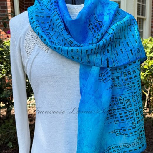 One of a kind women blue silk scarf hand painted and hand printed with a black cityscape.