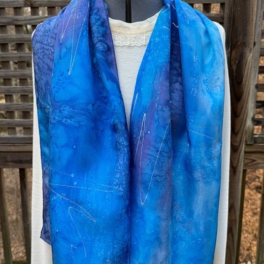 Women's abstract blue silk scarf hand painted using the batik technique