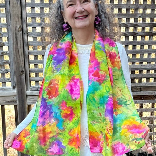 This colorful hand painted abstract floral silk scarf is a true piece of art and will bring a pop of color and joy to your wardrobe.