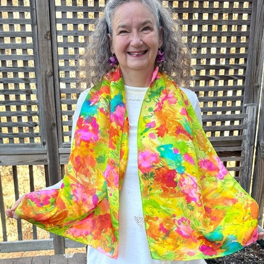 This colorful hand painted abstract floral silk scarf is a true piece of art and will bring a pop of color and joy to your wardrobe.
