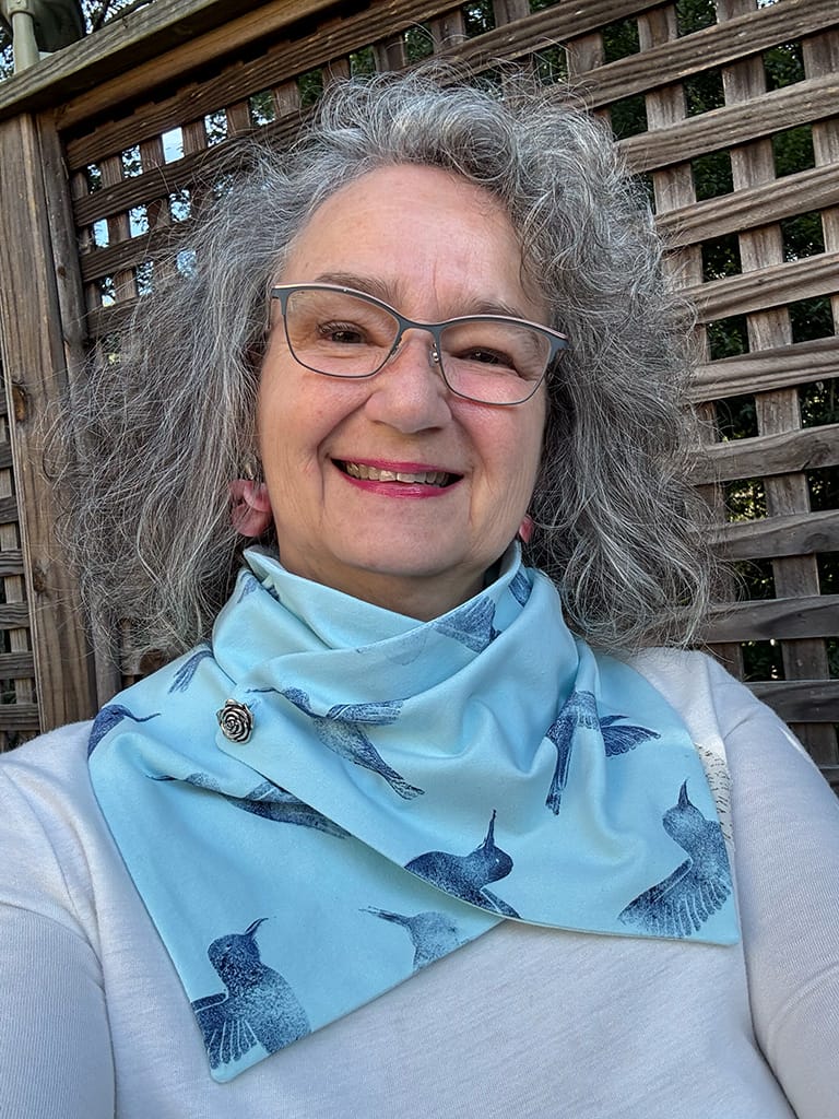 Women's light blue handmade neck scarf hand printed with dark blue hummingbirds