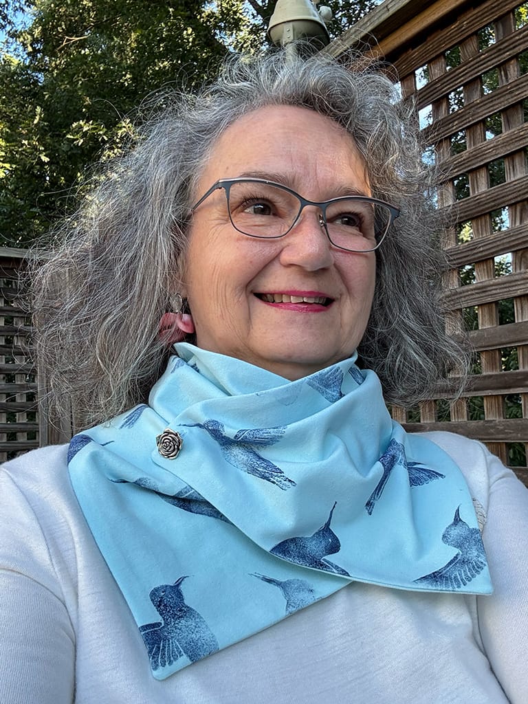 Women's light blue handmade neck scarf hand printed with dark blue hummingbirds