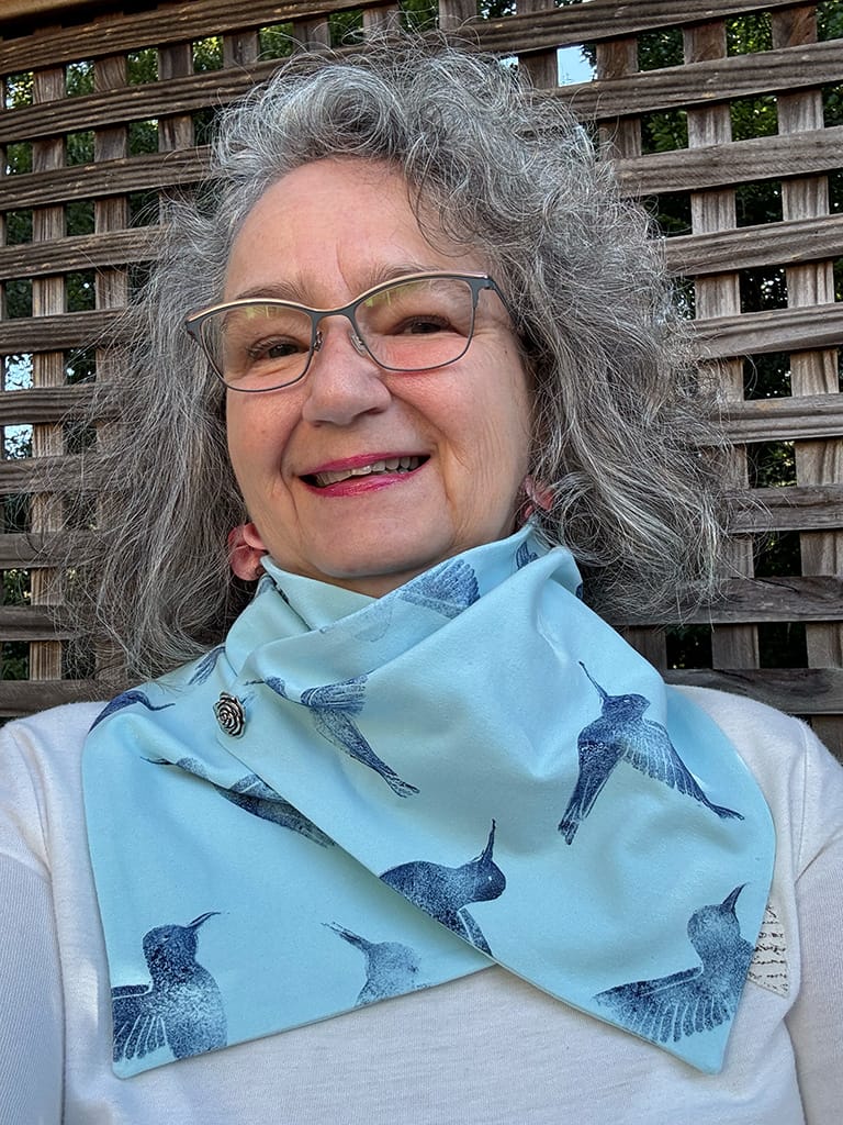 Women's light blue handmade neck scarf hand printed with dark blue hummingbirds