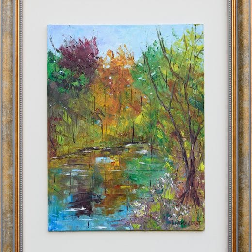 Original oil plein air painting of trees reflecting in a pond with autumnal color palette