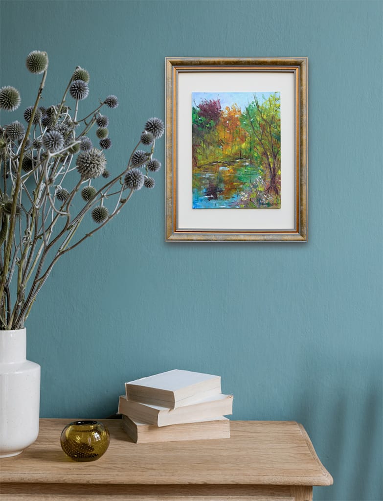 Original oil plein air painting of trees reflecting in a pond with autumnal color palette
