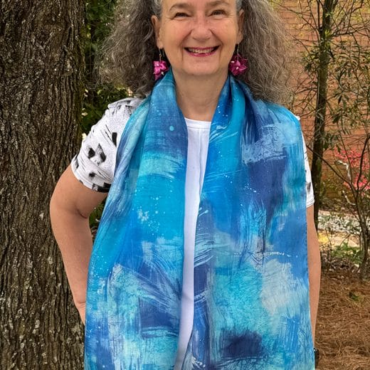 Women's hand painted abstract batik silk scarf in different shades of blues