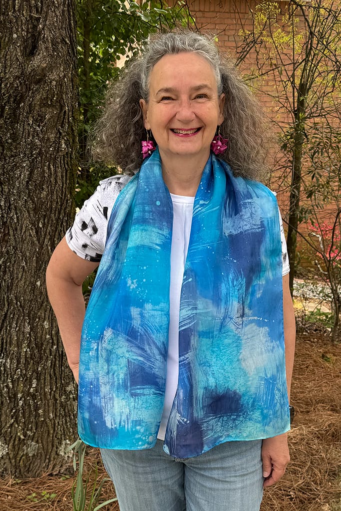 Women's hand painted abstract batik silk scarf in different shades of blues