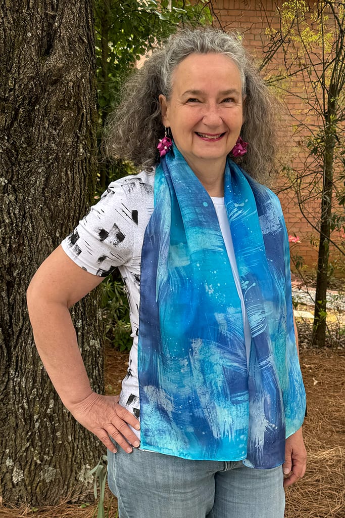 Women's hand painted abstract batik silk scarf in different shades of blues