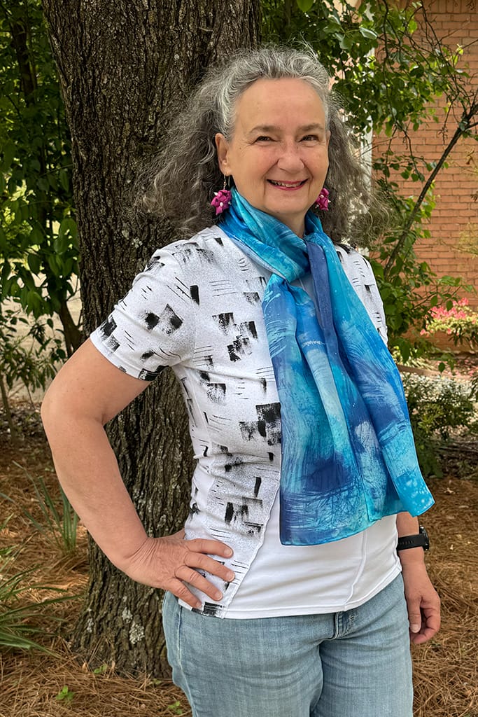 Women's hand painted abstract batik silk scarf in different shades of blues