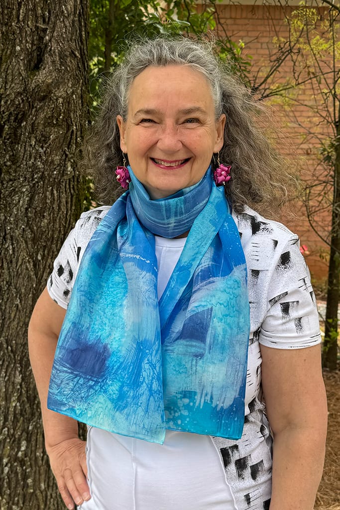 Women's hand painted abstract batik silk scarf in different shades of blues