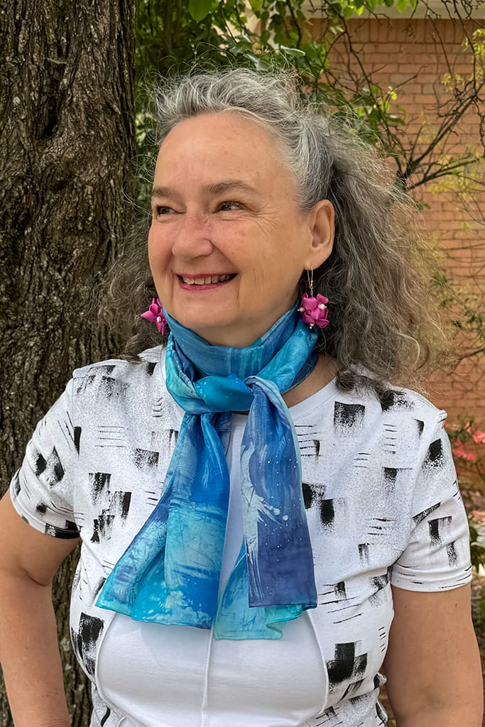 Women's hand painted abstract batik silk scarf in different shades of blues