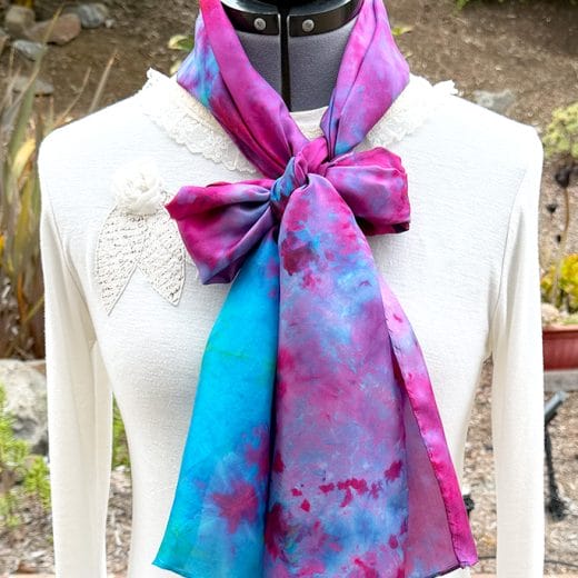 Women's hand ice dyed silk scarf in different shades of turquoise, hot pink and purple