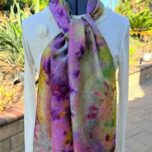 Women's silk scarf ice dyed in different shades of purple, green, hot pink and more.